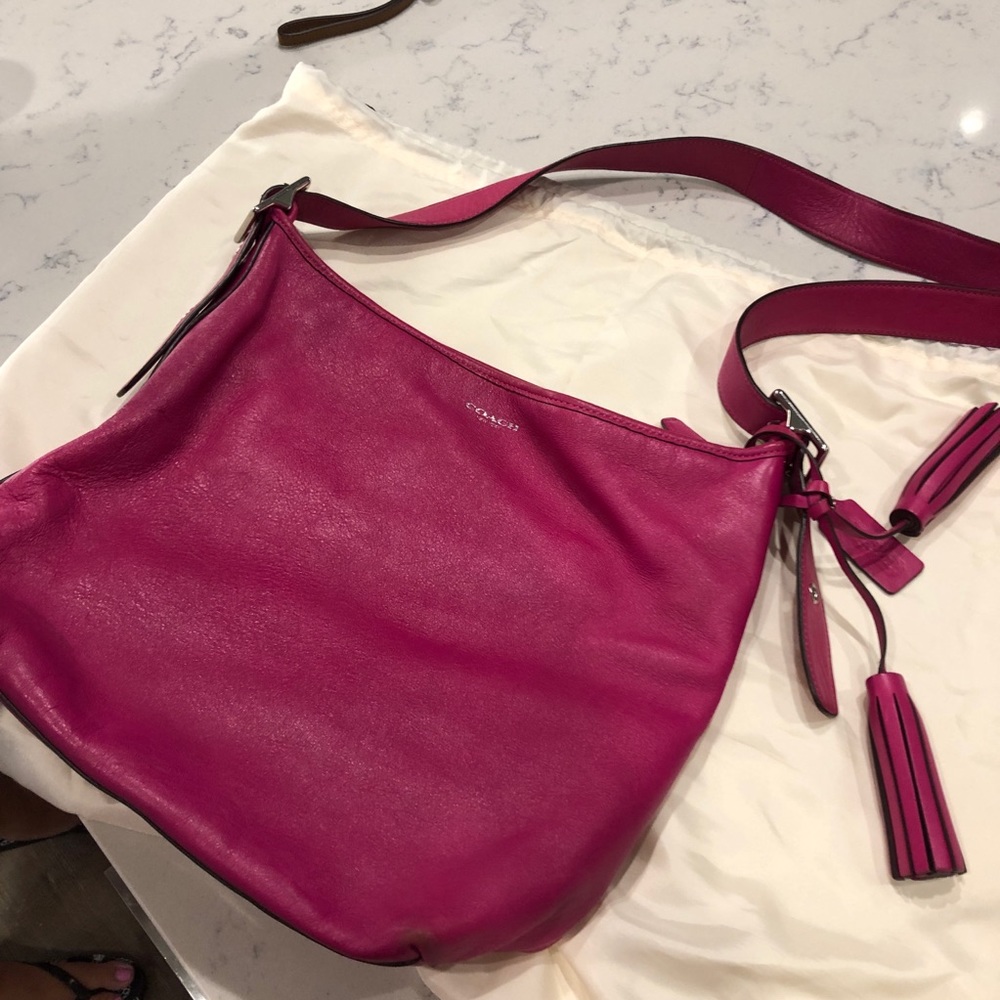 Coach pink bucket bag with tassel